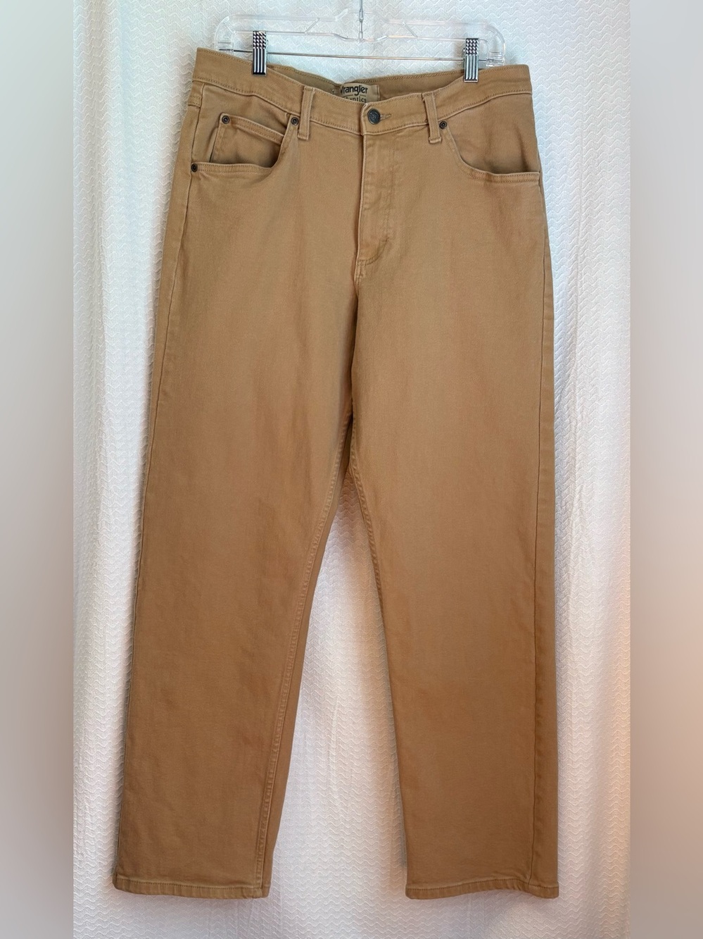 Wrangler authentic rugged straight leg tan jeans. Men’s size 33 x 32.
